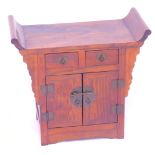 A Chinese mahogany table top cabinet, with an altar top above an arrangement of two drawers over two