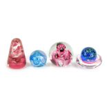A group of 20thC glass, comprising two Caithness pink and blue swirl paperweights, 4cm high, a large
