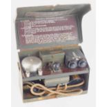 A World War II cased military telephone, in green cased tin, stamped MK.V, with morse code dials and