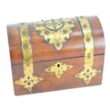 A Victorian domed walnut casket, with brass strap work and escutcheon, vacant interior, 17cm high, 2