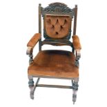 A Victorian oak open armchair, with shell and foliate carved crest rail, button back and seat uphols