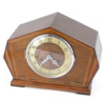 A 1950s Art Deco style walnut cased mantel clock, with a moulded case with fan banding, cream dial b