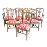A set of eight Chippendale style mahogany dining chairs, with red and white fabric drop in seats dec
