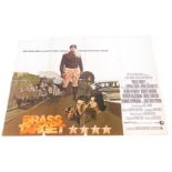 A 1970s film poster for Brass Target, 75cm x 102cm. (AF) Mike Bell was a prolific artist of film po