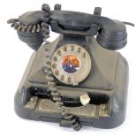 A Decca vintage dial telephone, in black plastic casing, 22cm high.