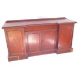 A Victorian mahogany breakfront sideboard, a central cushion drawer over a pair of panelled doors, f