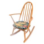 An Ercol model 428 ash and elm Windsor rocking chair, 61cm wide.