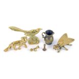 A group of brass wares, comprising a seated bird, fox, fly trinket box, miniature thistle shaped jug