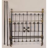 A Victorian metal double bed frame, comprising headboard, footboard, and two support rails, on eboni