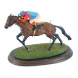 A Country Artists horse racing figure group, depicting Horse No 3 with rider, in blue and red, signe