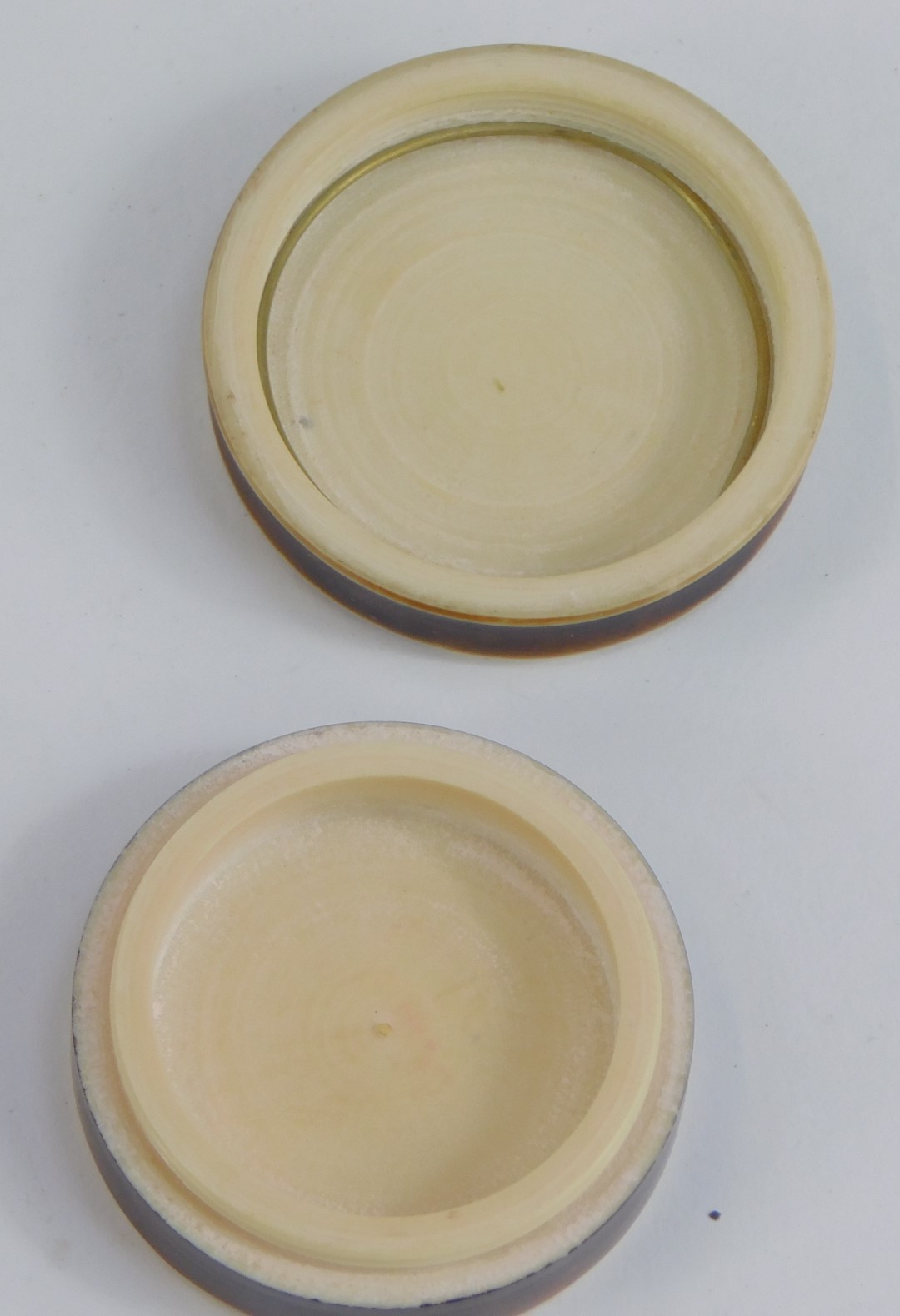 An Art Deco cream or ointment pot, with figure of lady in flowing dress and hat, 3.5cm diameter. - Image 2 of 2