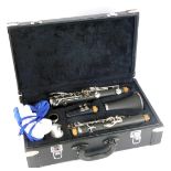 A cased clarinet, bearing barcoded label, stamped OITLO0CMO, in fitted black case, 12cm high, 37cm w