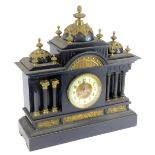 A French late 19thC black slate mantel clock, with three domed and turreted top, with gilt finials a