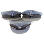 Three chauffeur's caps, each with blue lining and applied plastic crest. (3)
