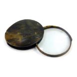 A horn cased magnifying glass, with oval case and magnifier, 10cm diameter.