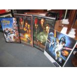 Star Wars posters, Oliver & Company advertising poster, and two framed Pirates of the Caribbean post