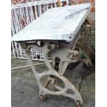A cast iron mangle base table.