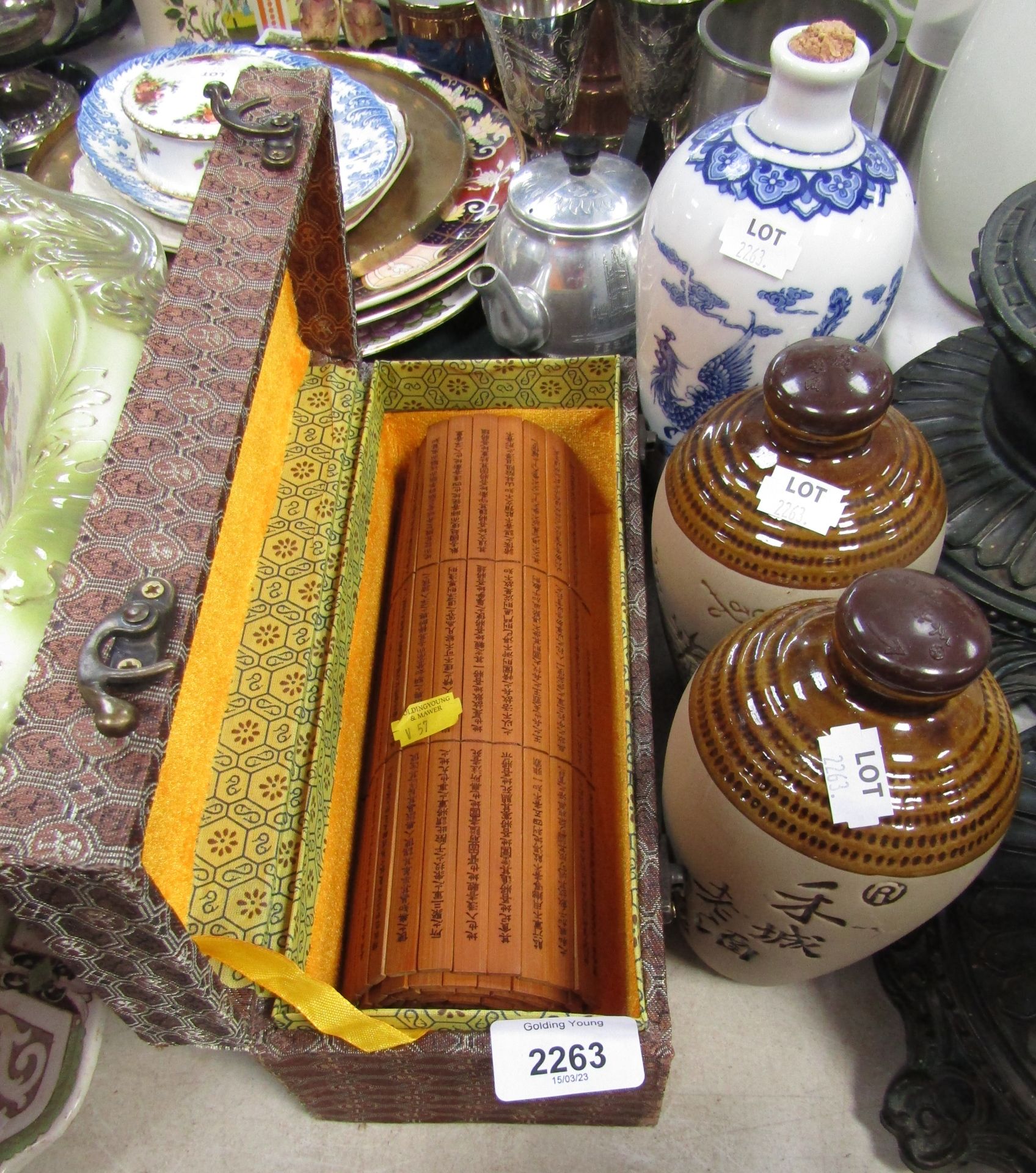 A modern Oriental scroll, two stoneware jars, and a blue and white jug. (4)