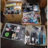 A large quantity of headphones and phone accessories, arm band wrist straps, sunglasses, in-ear head