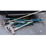 A group of garden tools, to include rakes, hoes, brushes, etc. (a quantity)