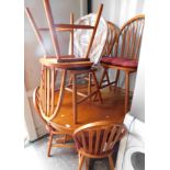 A pine extending circular kitchen table, and six chairs. (7)