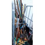 A quantity of garden tools, shears, lawn spreader, snow shovel, work bench, etc. (1 cage)