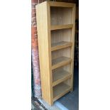 A light oak finish bookcase.