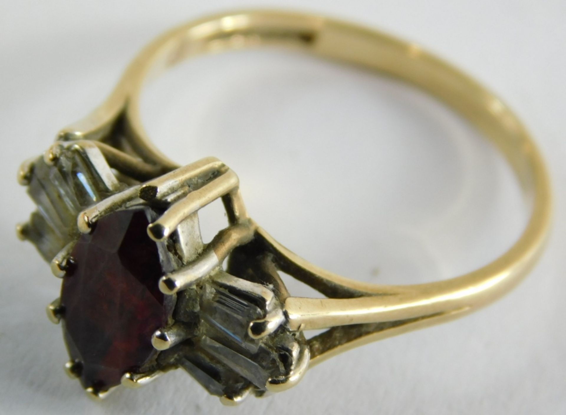 A 9ct gold garnet and cz set dress ring, in the Art Deco style with marquise shaped central garnet f - Image 2 of 3