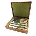 A cased set of Francis Newton base metal knives, with silver handles, in a mahogany canteen, 25cm wi