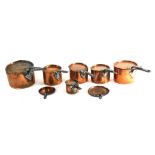 Various early 20thC copper pans, graduated part sets, some with lids, 12cm high, etc. (a quantity)