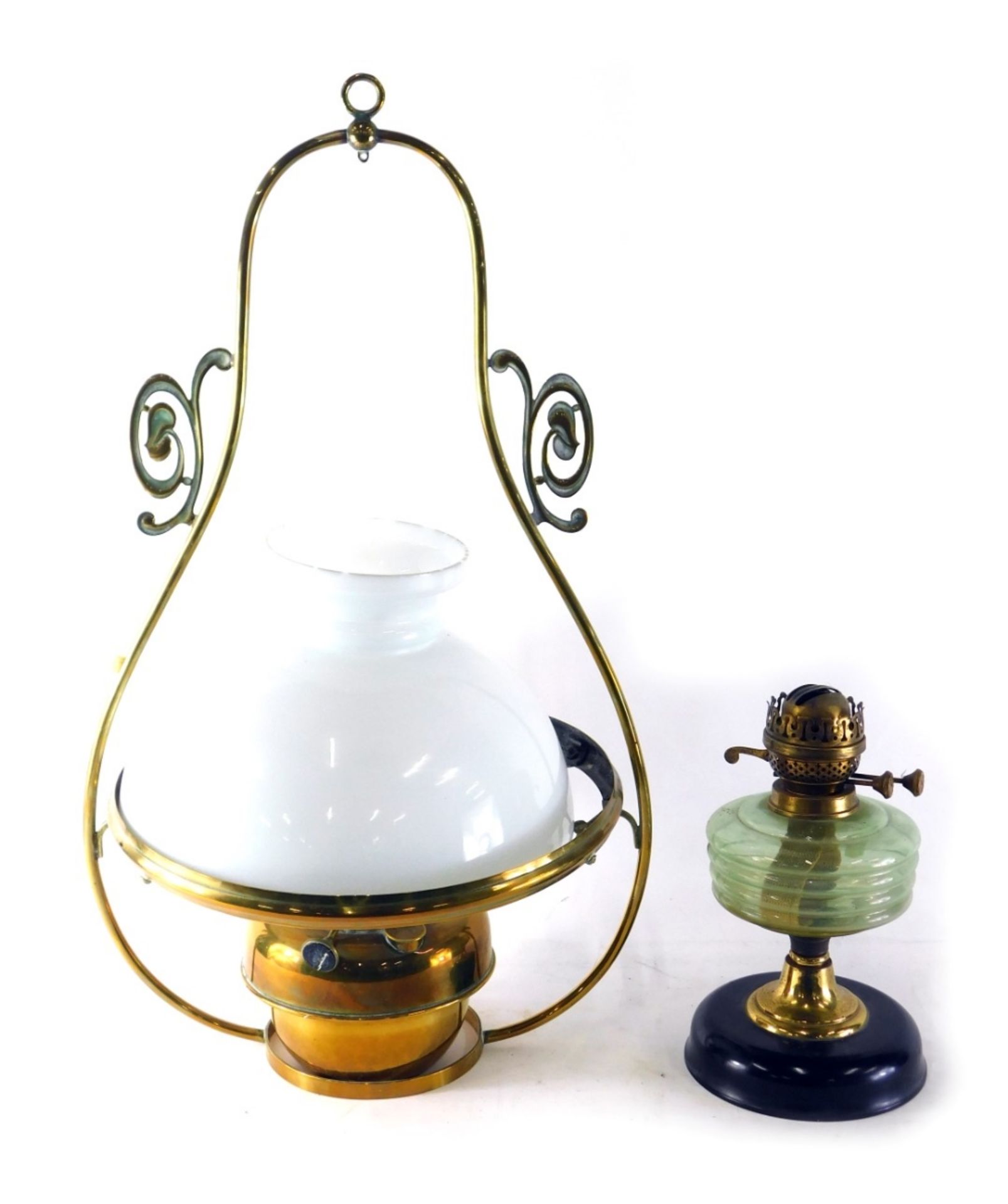 A brass hanging lantern lamp, with milk glass shade, 71cm high, and a glass oil lamp.