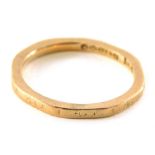 A 9ct gold wedding band, of hammered and engraved design, ring size L, 2g all in.