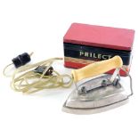 A Prilect child's or travel iron, in fitted tin case, 13cm wide.