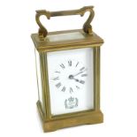 A 20thC Silver Jubilee brass carriage clock, with Royal Crest to the 6cm wide Roman numeric dial, in