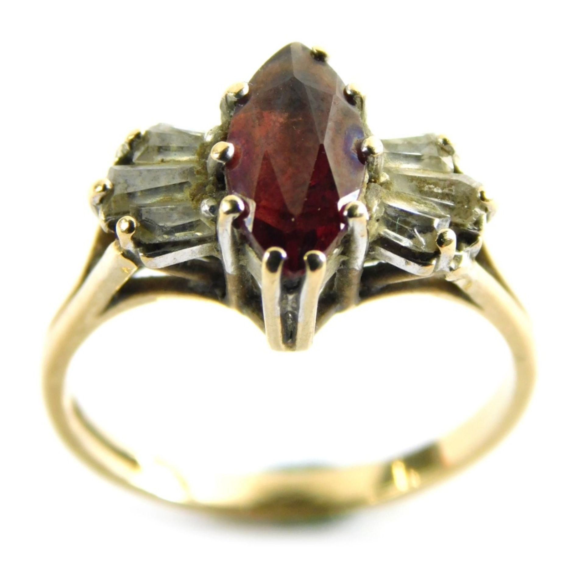 A 9ct gold garnet and cz set dress ring, in the Art Deco style with marquise shaped central garnet f