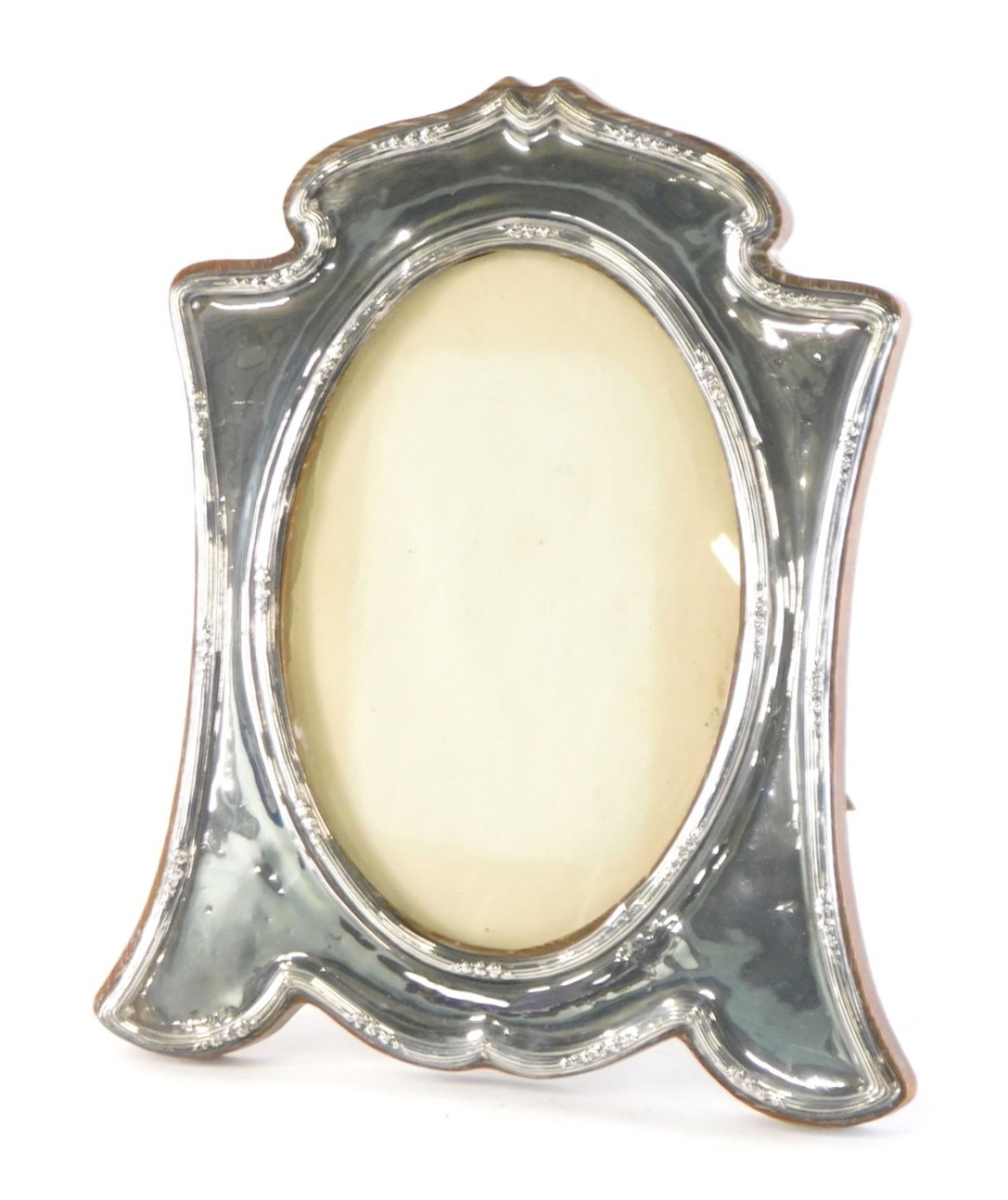 An Edward VII silver photograph frame, with oak easel back and plain oval centre, Birmingham 1910, 2