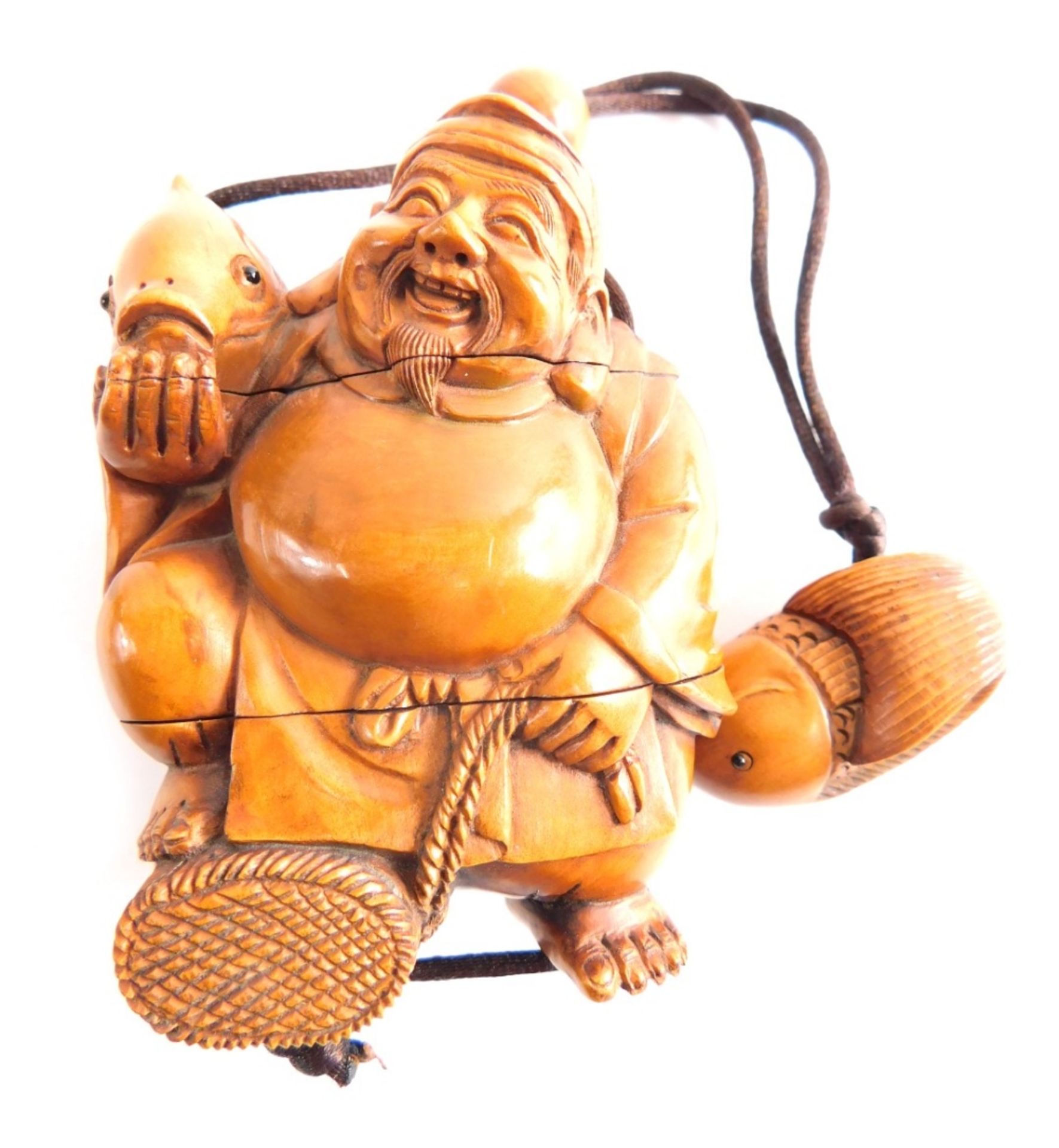 A carved Japanese wood fisherman Inro, with carved fish end, the main body 8cm high.