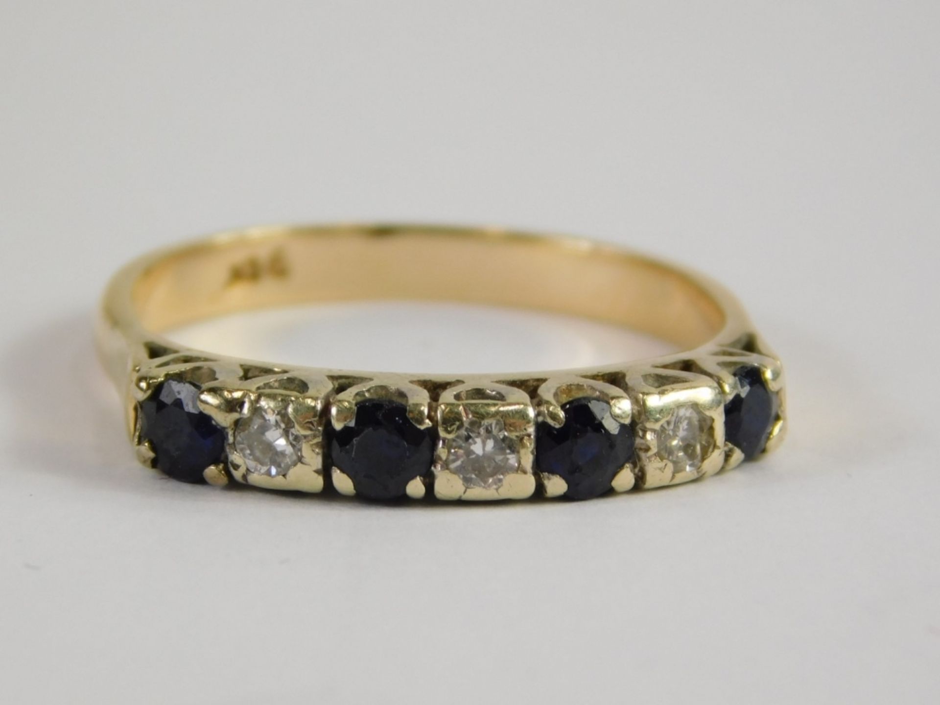 An 18ct gold sapphire and diamond half hoop dress ring, set with five round brilliant cut sapphires, - Image 3 of 4