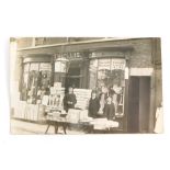 A 20thC Lincoln city postcard, shop front T. H. Ellis, reputed to be at The Waterside.