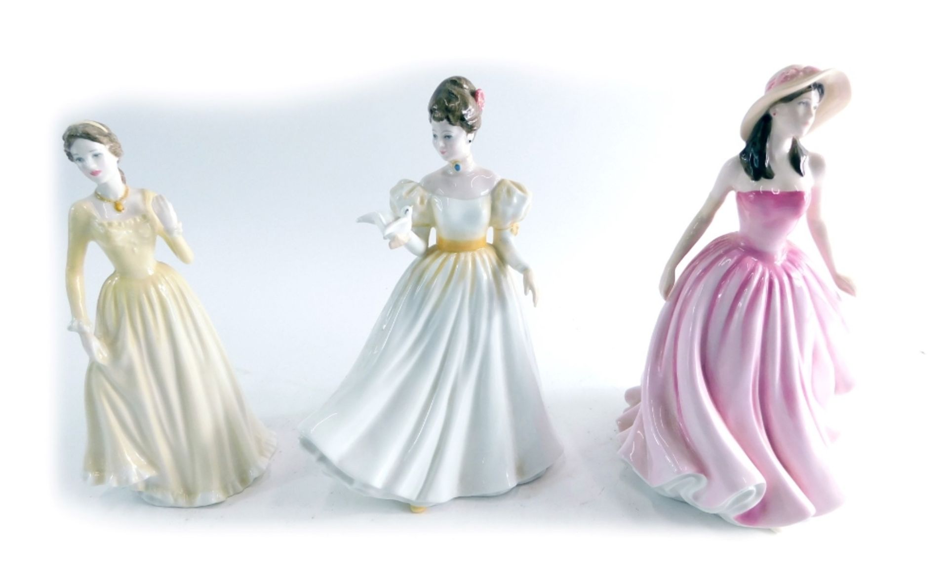 Three Royal Doulton figures, to include Lisa HN 4525, printed marks beneath 19cm high (3, boxed).