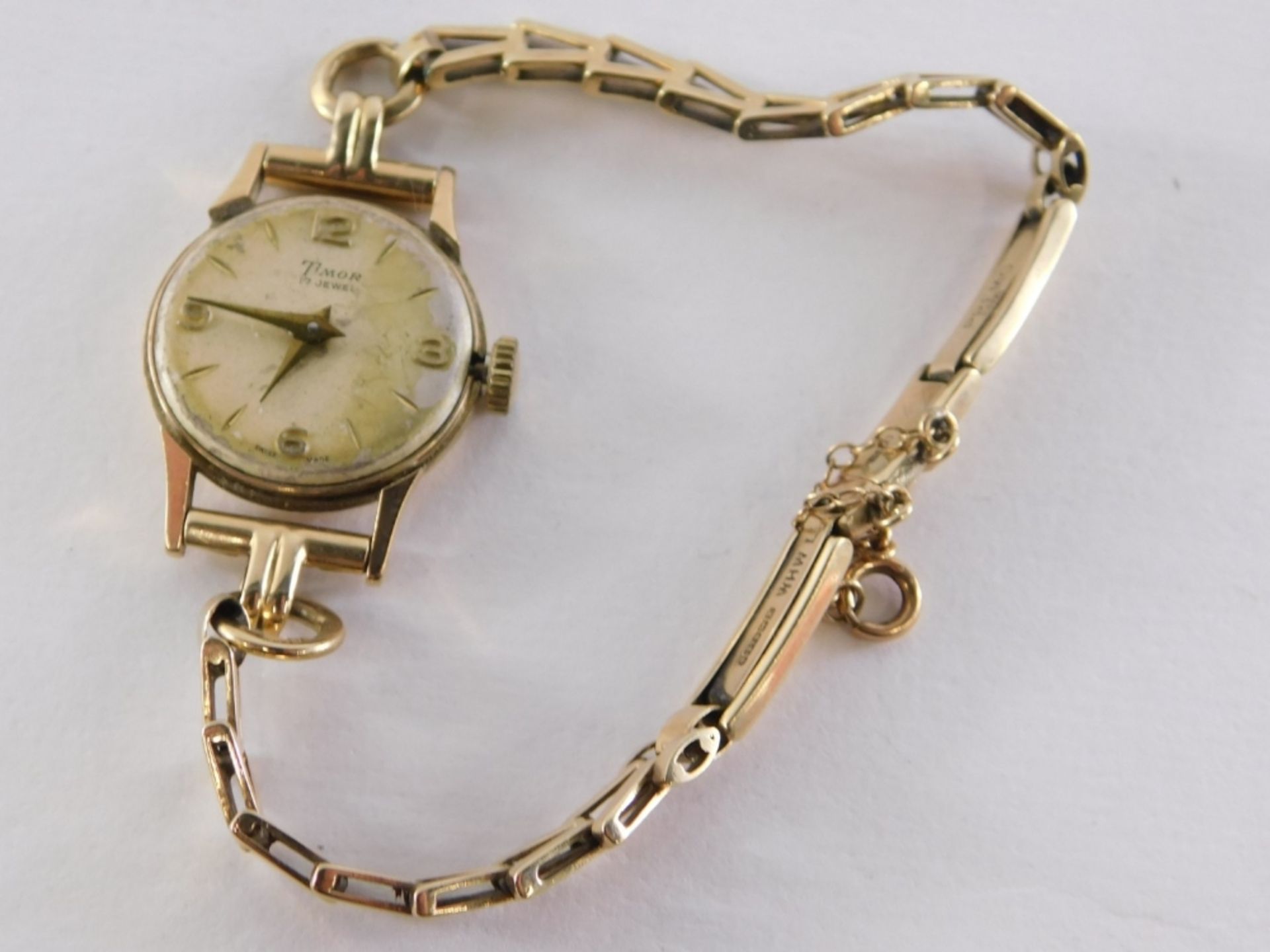 A 9ct gold Timor ladies wristwatch, with V splayed bracelet and safety chain, lacking glass covering - Image 2 of 3