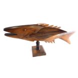 A 20thC carved souvenir from Pitcairn Island fish sculpture, on plinth base, 42cm long.