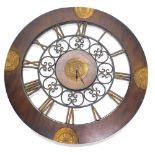 A modern wall clock, in hardwood frame, with pierced Roman numeric centre, battery operated, 82cm di