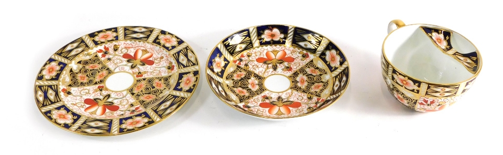 A Royal Crown Derby Imari pattern moustache cup trio, comprising cup, saucer and side plate, 17cm di