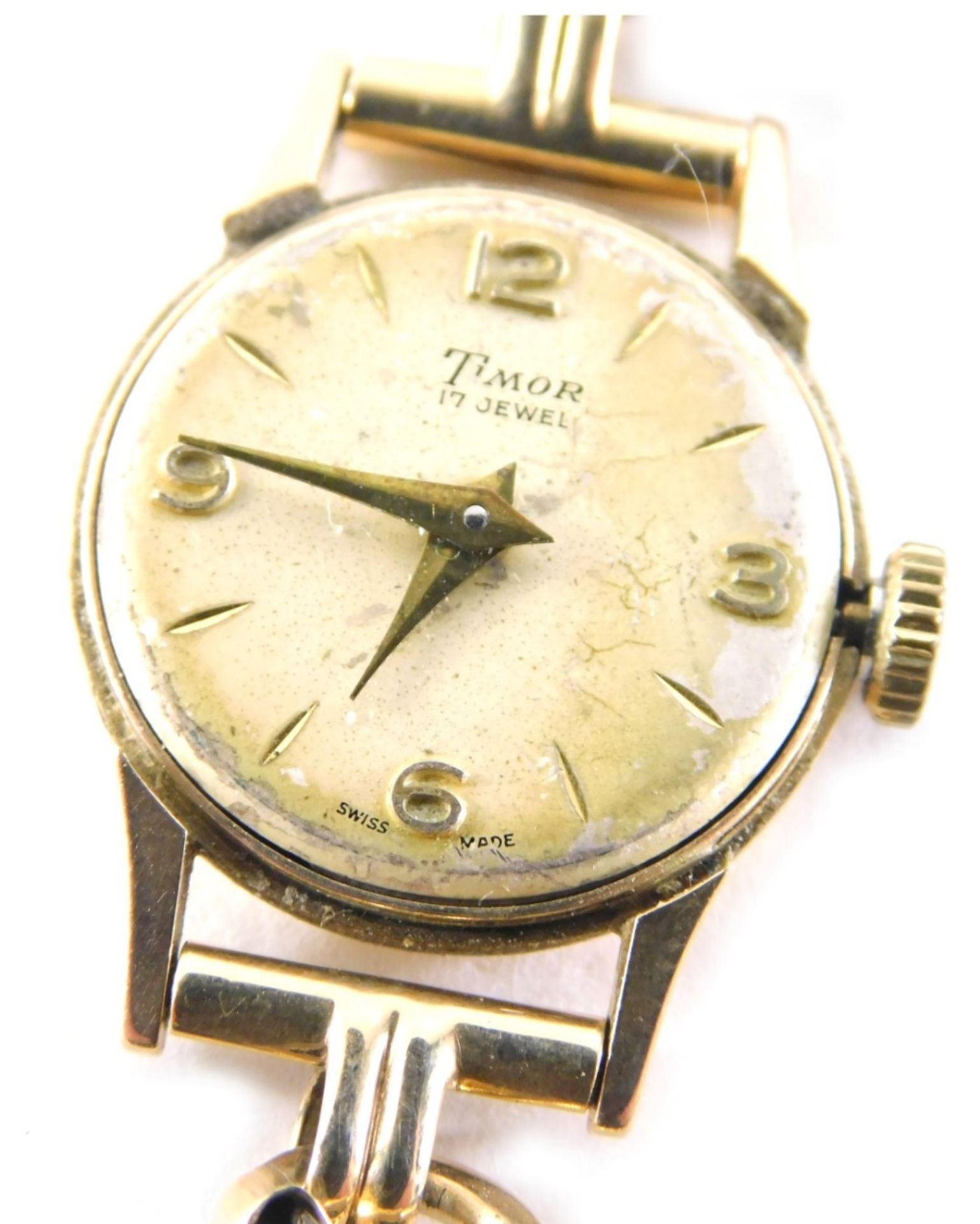 A 9ct gold Timor ladies wristwatch, with V splayed bracelet and safety chain, lacking glass covering