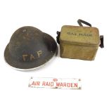 Various militaria and military items, a tin FAP helmet with leather interior and material chin strap