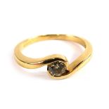 A 9ct gold diamond twist ring, set with round brilliant cut diamond approx 0.25ct, in a tension twis