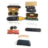 Various optical items and spectacles, iron rimmed pair of spectacles with plain side bars, in case,