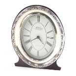 An Elizabeth II silver fronted mantel clock, marked R Carr Clock Makers, with 8cm wide paper dial pr