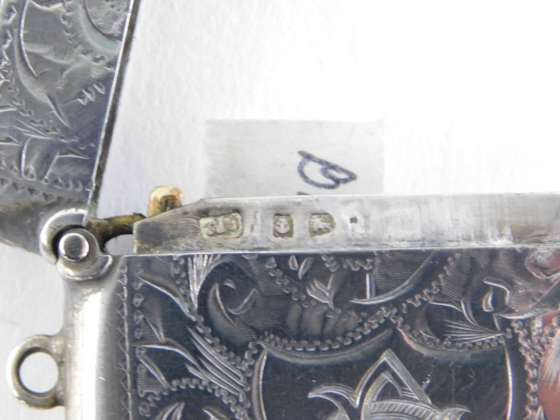 An Edward VII silver Vesta case, of oblong form, chased with flowers, initialled cartouche and plain - Image 2 of 2